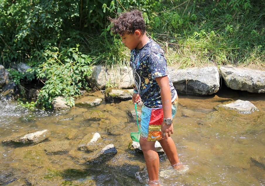 Camper playing in creek